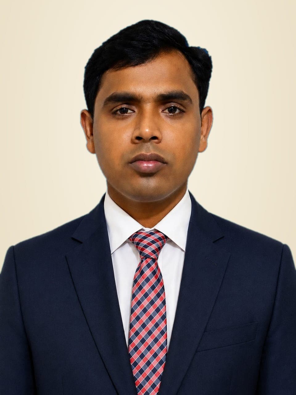 Portrait of Ratan Sarker, tax lawyer, in a dark suit